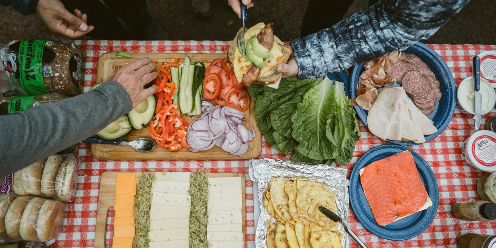 food spread on picnic blanket