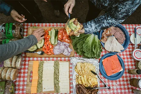 food spread on picnic blanket