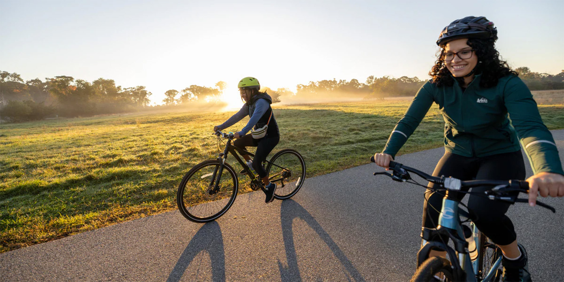 two people riding bikes