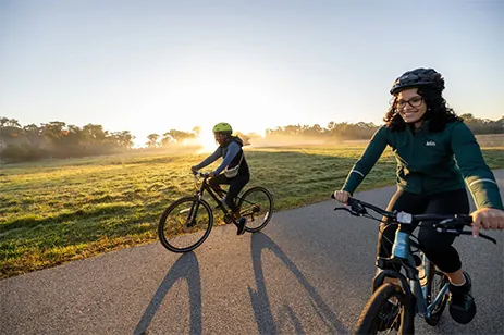 two people riding bikes