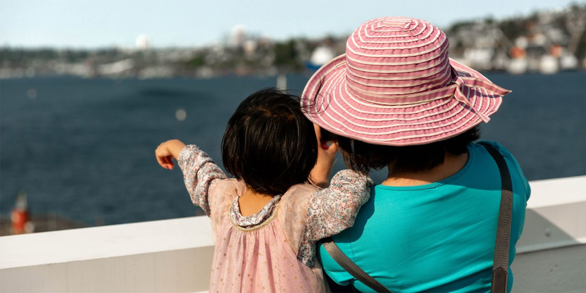 woman and child looking at lake