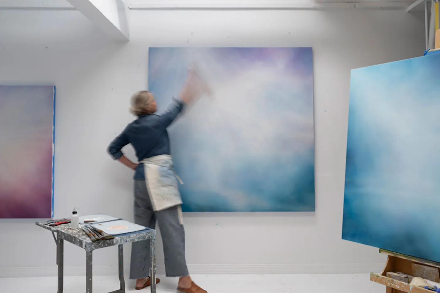 woman painting in art studio