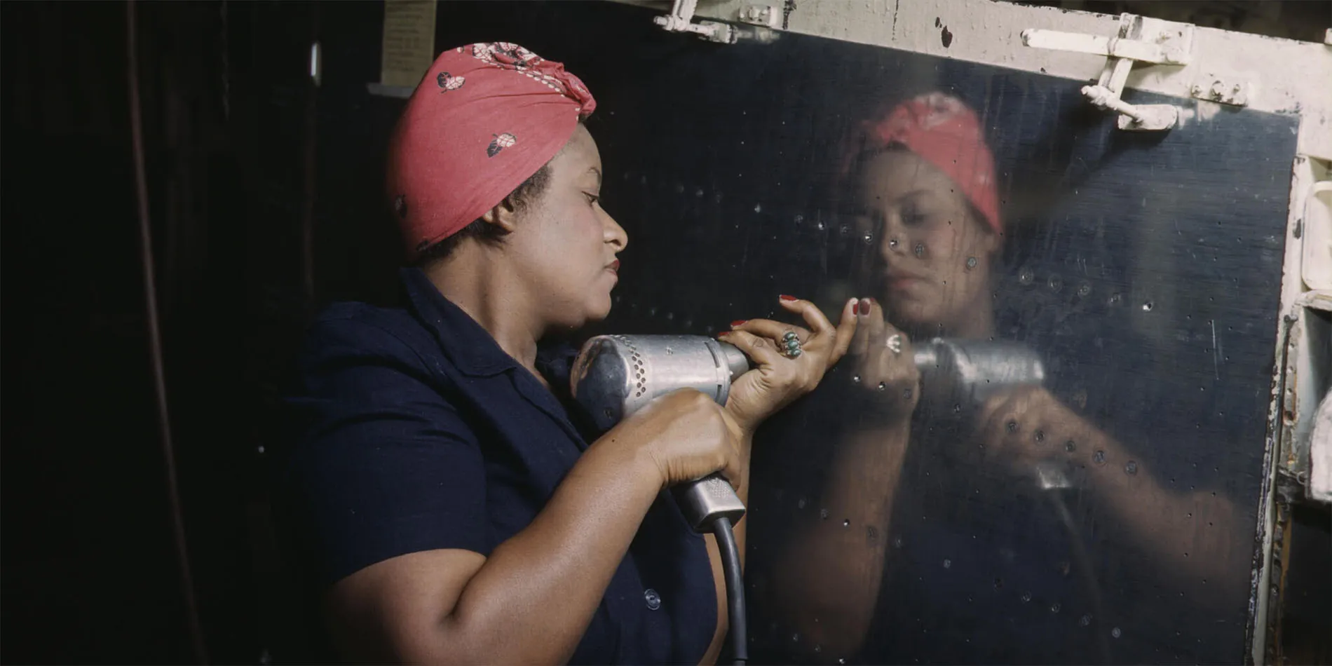 black woman using riveting tool