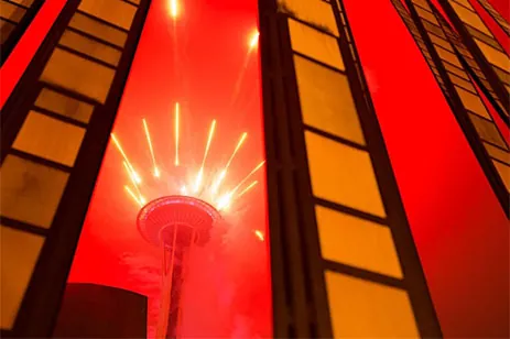 red image of space needle and buildings