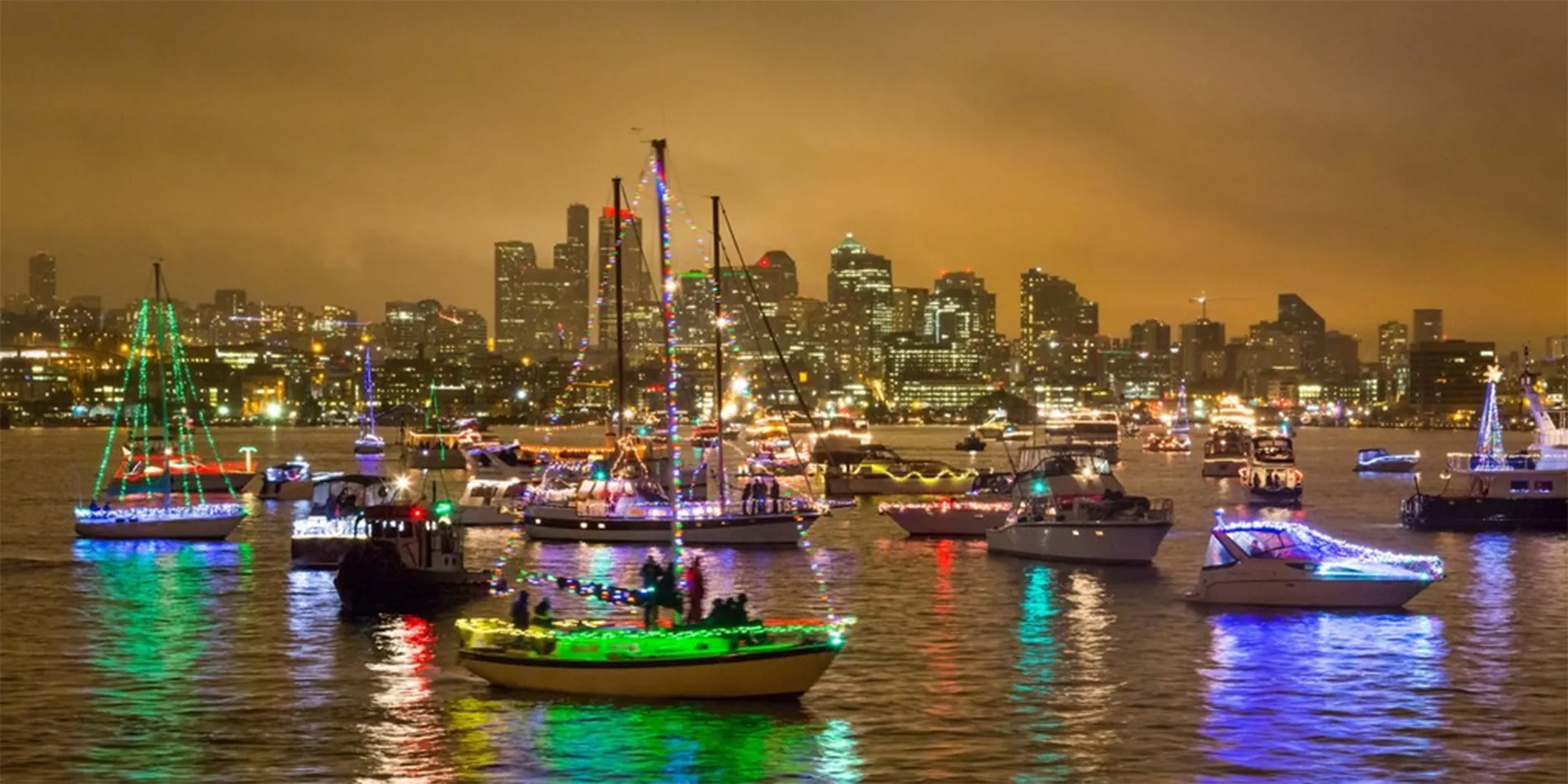 cruise ships on lake with holiday lights