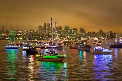 cruise ships on lake with holiday lights