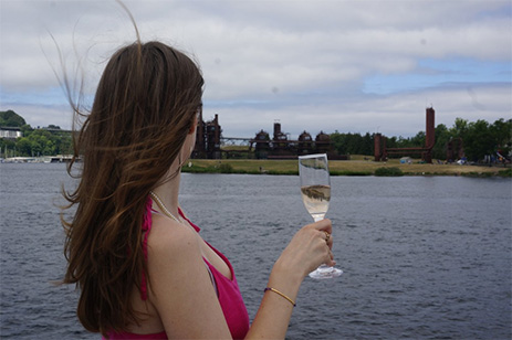 woman with champagne glass on boat