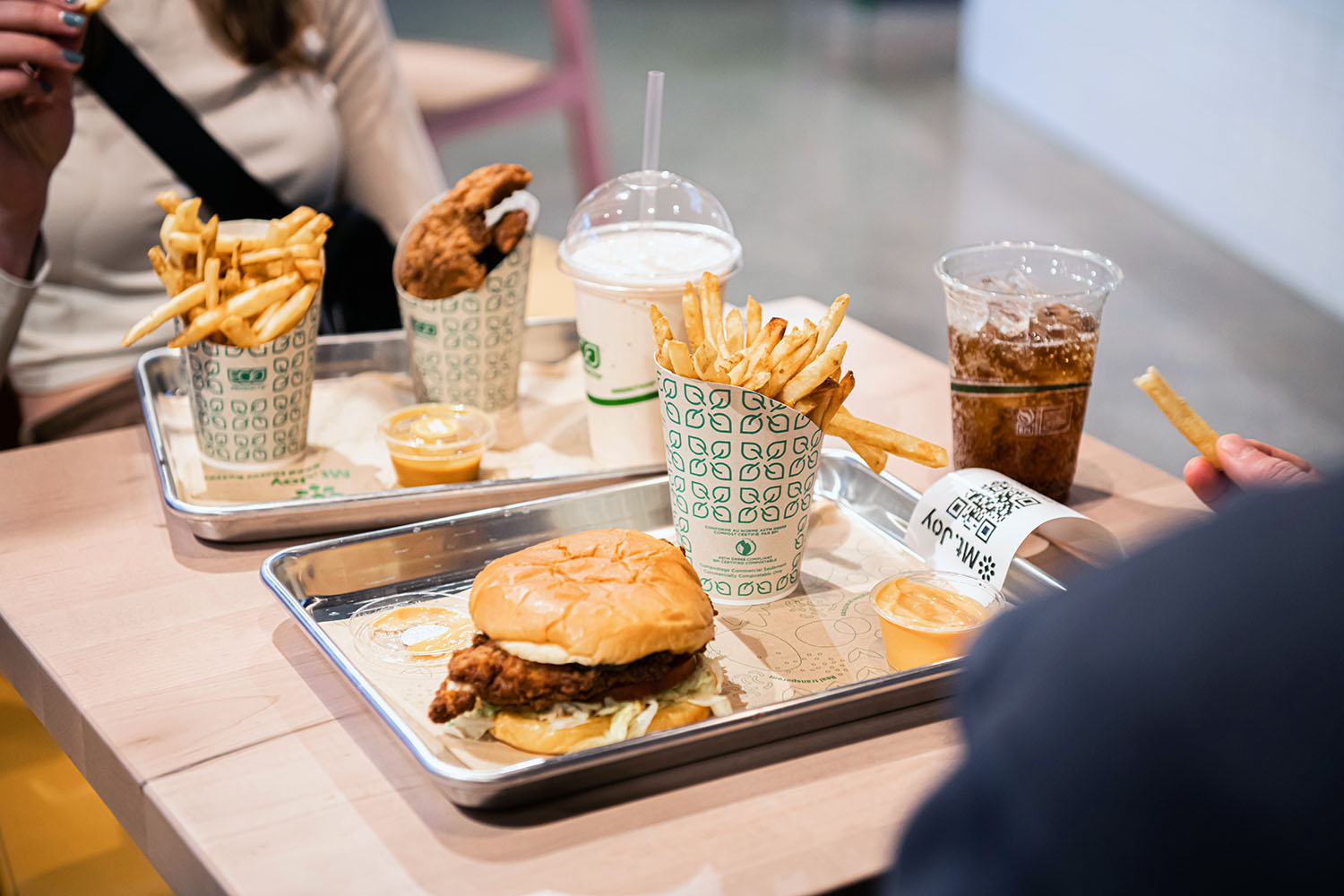 close up of fries, burgers, chicken tenders, drinks