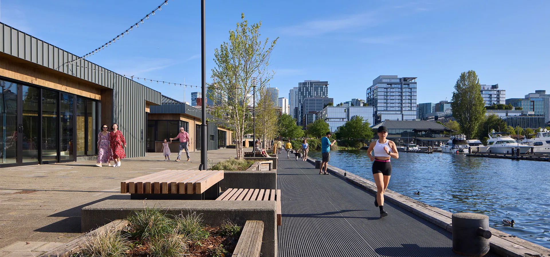 people walking and running along promenade