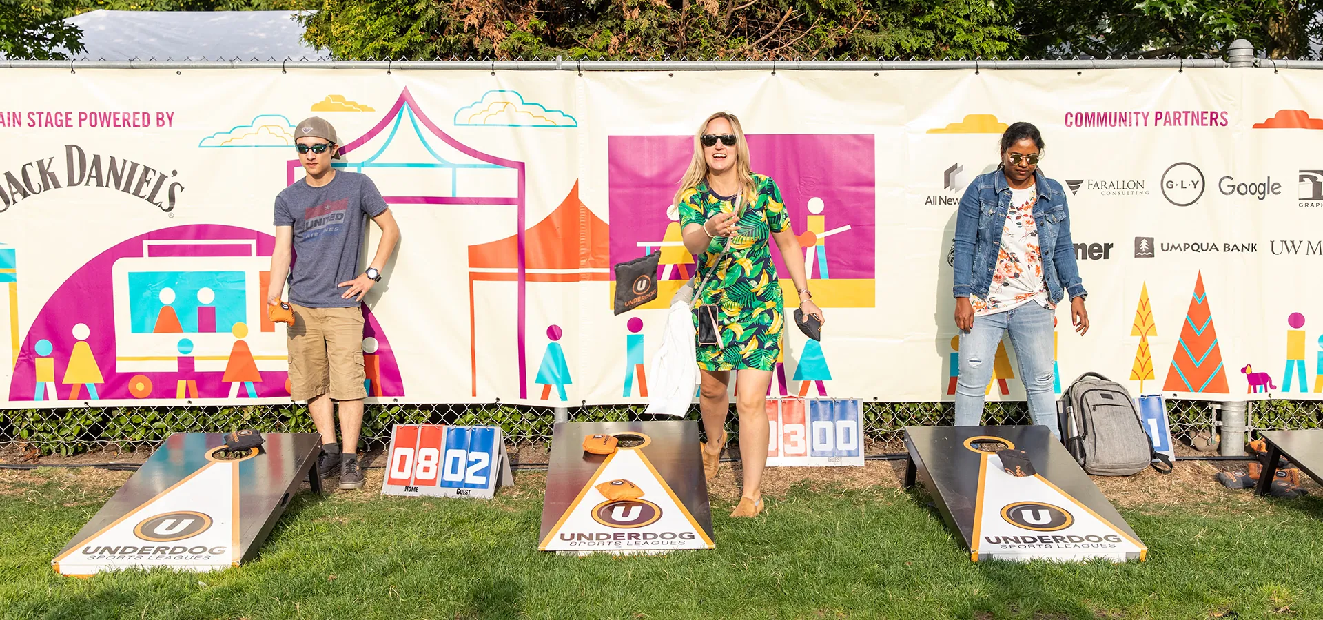 people playing cornhole at slubp