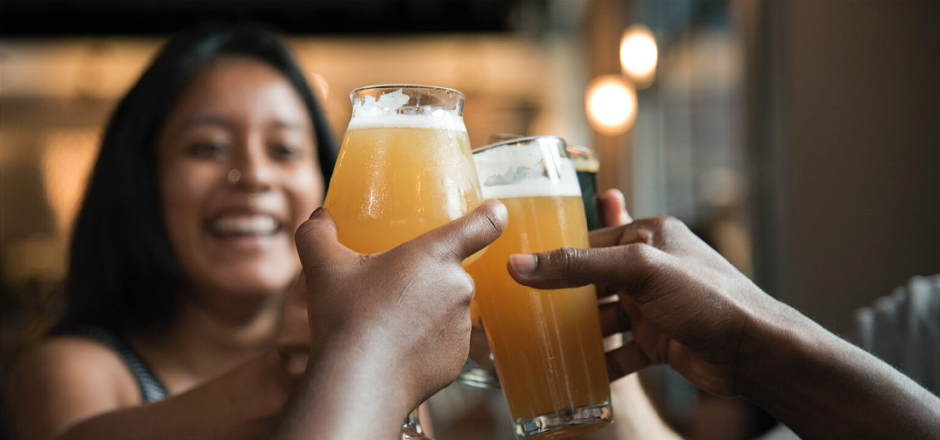 people cheersing with beer