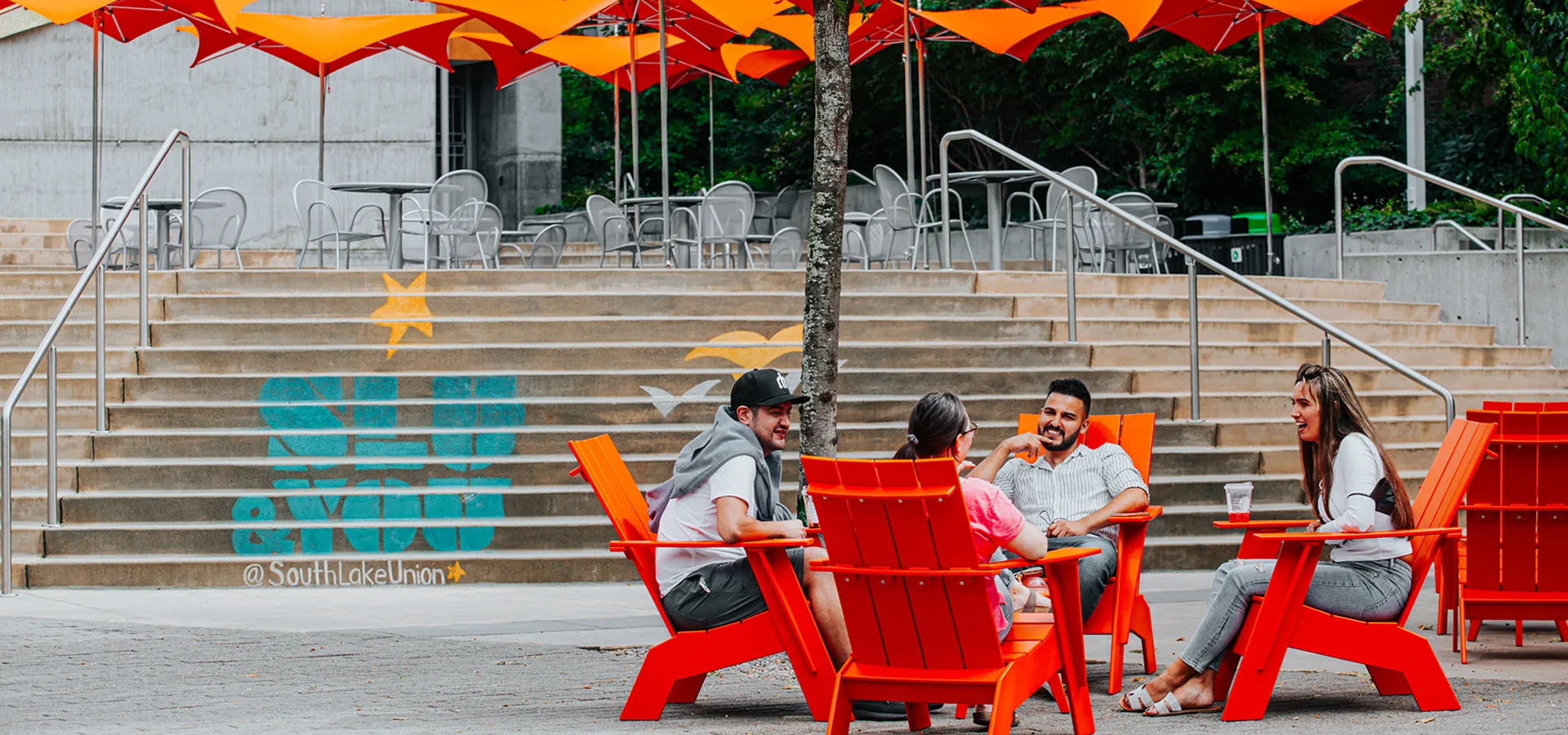 people sitting at plaza table