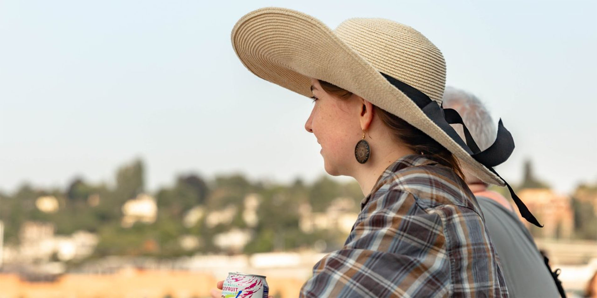 woman in hat looking off into distance