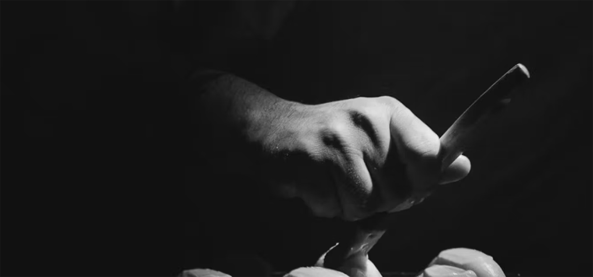 closeup of hand on black background