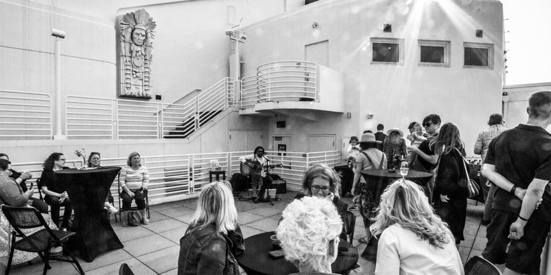 b&w image of people seated outside