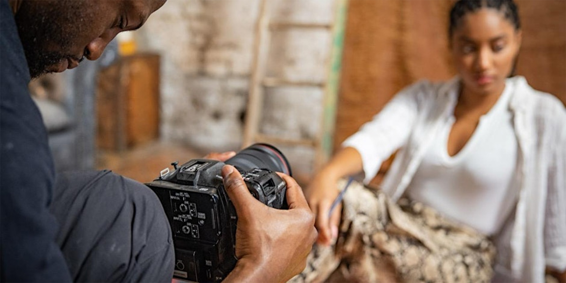 man filming woman