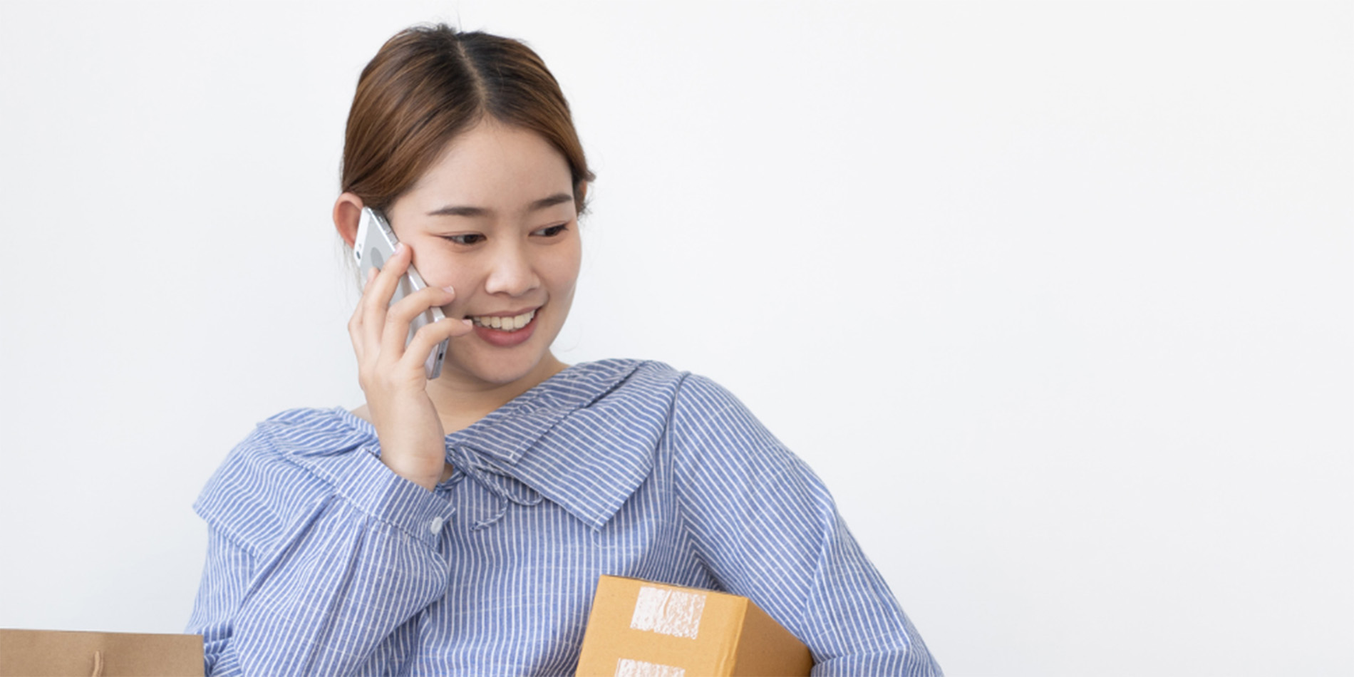 stock photo of women with phone and boxes