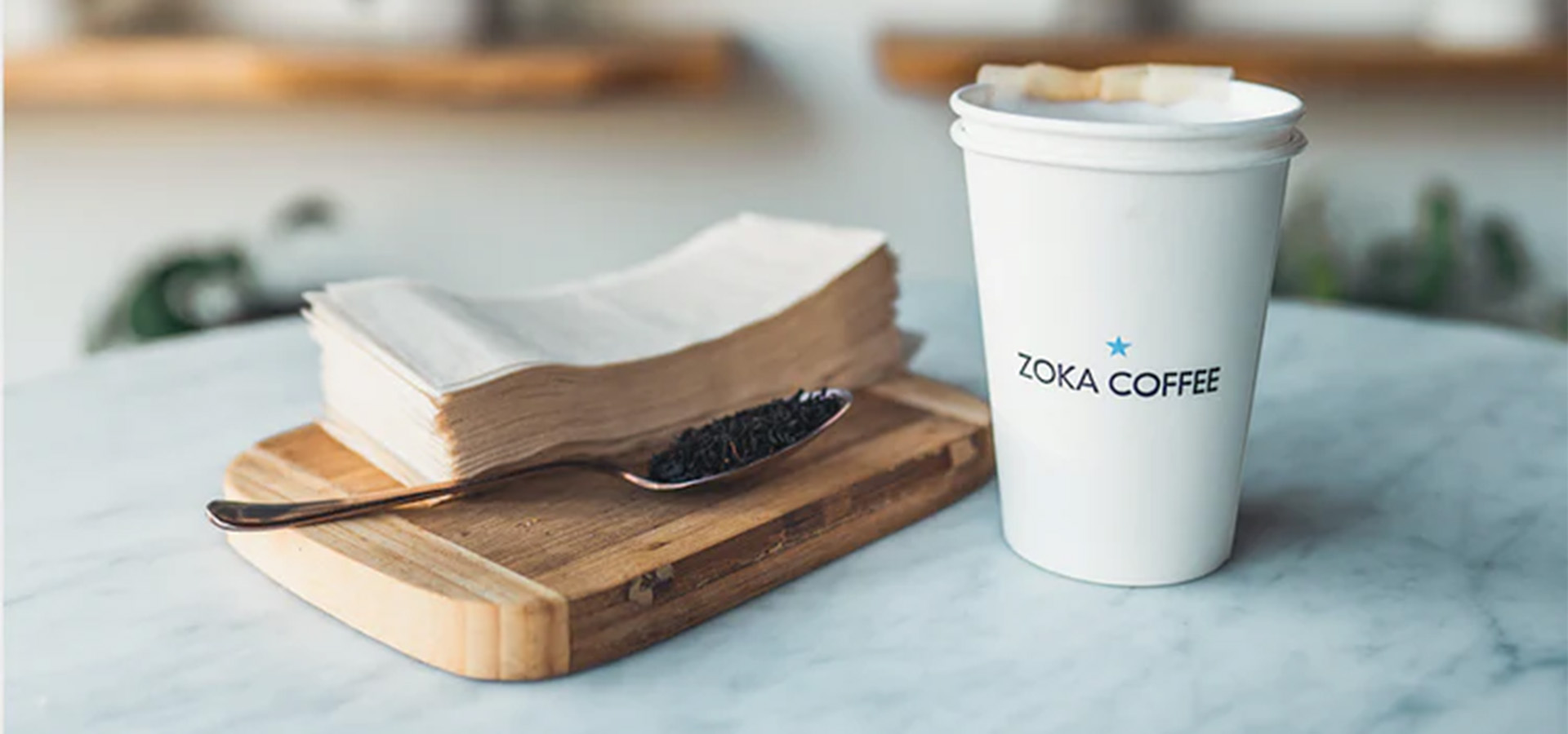 tea bags and branded to-go cup
